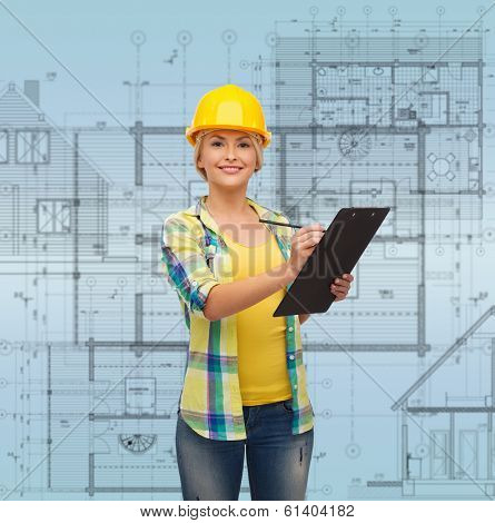 repair, construction and maintenance concept - smiling woman in helmet with clipboard