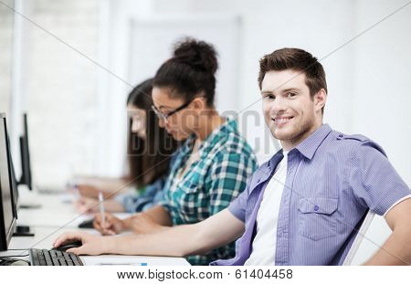 education concept - student with computer studying at school
