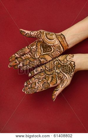 beautifully decorated indian hands with mehandi typically done for weddings