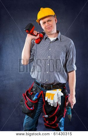 Construction worker holding a drill