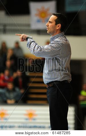 KAPOSVAR, HUNGARY - MARCH 8: Adam Fekete (Kaposvar trainer) in action at a Hungarian Championship basketball game with Kaposvar (white) vs. Paks (red) on March 8, 2014 in Kaposvar, Hungary.