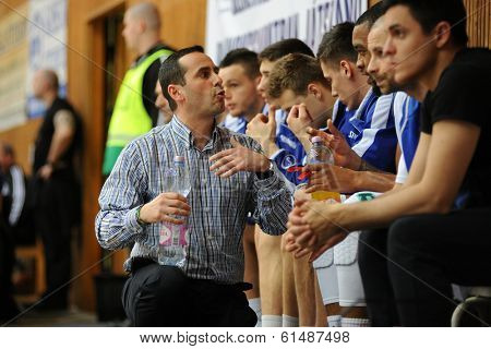 KAPOSVAR, HUNGARY - MARCH 8: Adam Fekete (Kaposvar trainer) in action at a Hungarian Championship basketball game with Kaposvar (white) vs. Paks (red) on March 8, 2014 in Kaposvar, Hungary.