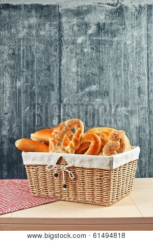 Delicious Bread And Rolls In Wicker Basket
