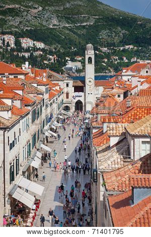 DUBROVNIK, CROATIA - MAY 26, 2014: View on Stradun and the Bell tower from old city walls. Stradun is 300 meters long main pedestrian street in Dubrovnik.