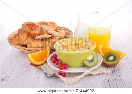 breakfast with cornflakes,croissant and fruits