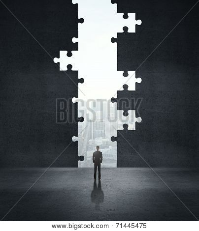 Businessman Looking To Puzzle Hole