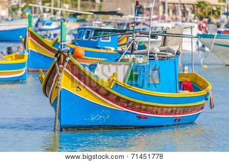 Traditional Luzzu Boat At Marsaxlokk Harbor In Malta.