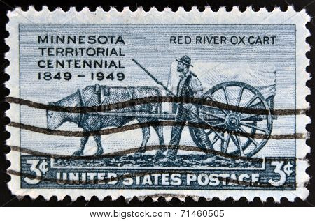 UNITED STATES OF AMERICA - CIRCA 1949: A stamp printed in USA shows the Pioneer and Red River Oxcart