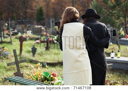 Widow Supported By A Friend