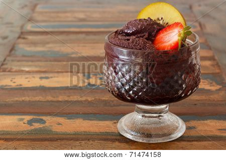Acai Pulp In Glass With Strawberry And Kiwi On Wooden Table