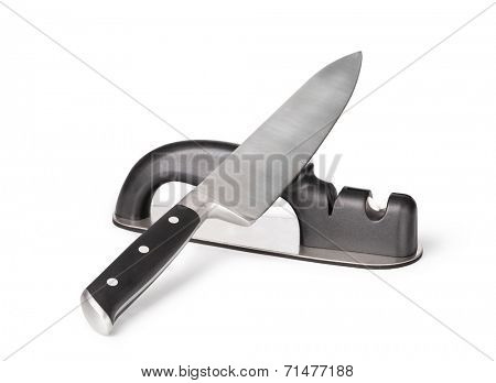 Grindstone and knife isolated on the white background