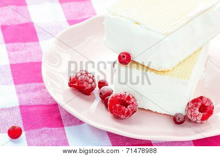 White Vanilla Ice-cream With Waffles And Raspberries. Closeup.