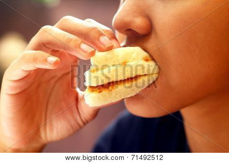 Eating A Sandwich With Gusto.