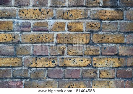 Covered with soot brick wall