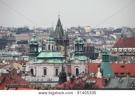 Saint Nicholas Church in Old Town Square and the Old Town Hall viewed from the Letna Park in Prague, Czech Republic. 