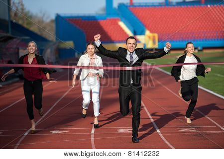 business people running together on racing track