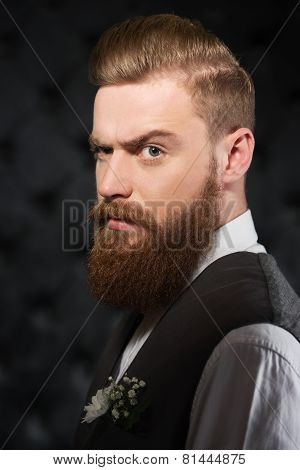 Serious man with beard and severe look