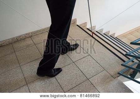 Blind Man Walking Near Stairway