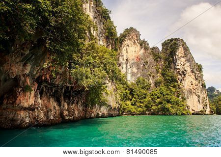 Cliffy Island In Azure Sea Water