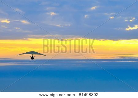 Motor Hang Glider In The Cloudy Sunset