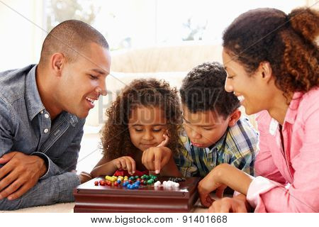 Mixed race family playing solitaire