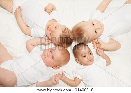 View from top of sweet babies laying in star shape