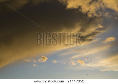 A black cloud covers the sun on a blue sky