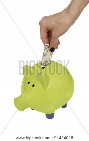 Green Piggy Bank And Woman Hand Isolated Over White