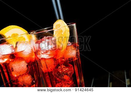 Spritz Aperitif Aperol Cocktail With Orange Slices And Ice Cubes On Black