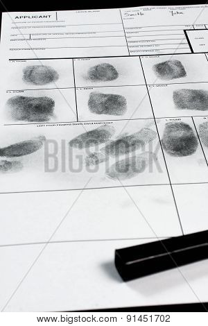 Fingerprint on police fingerprint card.