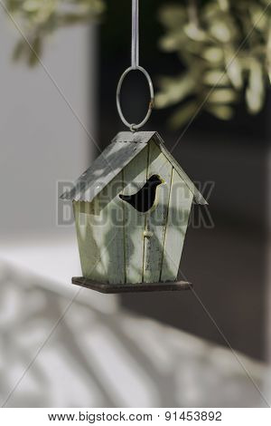 Decorative Birdhouse In Vintage Style On The Branch Of An Olive Tree