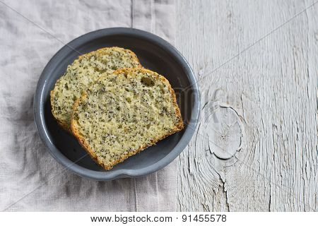 Simple Cake With Poppy Seeds In A Vintage Plate On A Light Wooden Surface