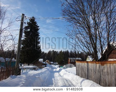 Village in winter sunny day