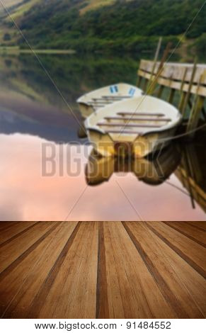 Rowing Boats Moored At Jetty On Llyn Nantlle In Snowdonia National Park With Wooden Planks Floor