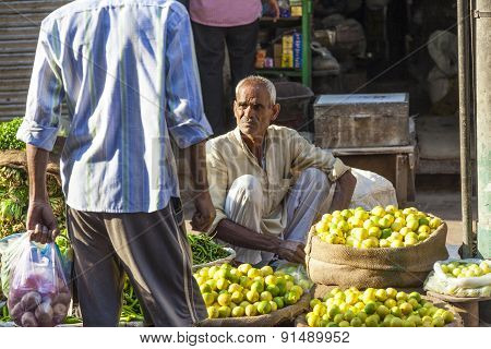 Man Selling Vegetables At Chawri Bazar In Delhi, India