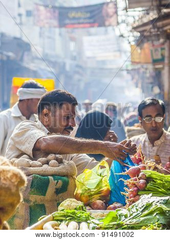 Man Sells Bananas At The Old Vegetable Street Market In Delhi