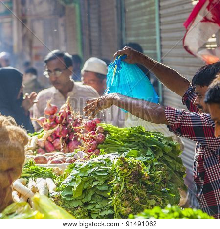 Man Sells Bananas At The Old Vegetable Street Market In Delhi