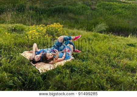Mother And Daughter Make Selfy On The Rug