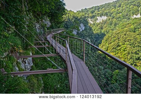 Aerial road in Okace (Okatse) kanyon - Georgia. All rocks are covered with bright green foliage. Modern tourist landmark and attraction in Georgia mountains.
** Note: Visible grain at 100%, best at smaller sizes