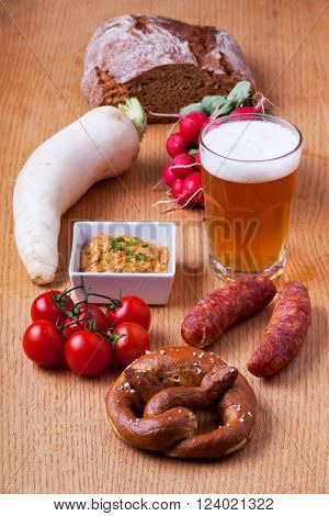 typical bavarian snacks with beer on wood