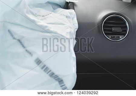 the airbag is fired during the accident. Blue. The inscription airbag and the sticker on the panel.