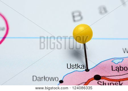 Photo of pinned Ustka on a map of Poland. May be used as illustration for traveling theme.