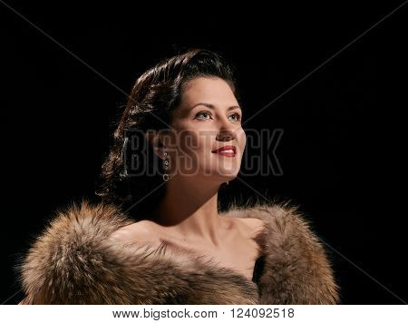 woman studio portrait in hollywood style light on black background