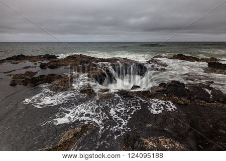 Feature known as Thor's Well in the central Oregon coast with a drama and natural wonder