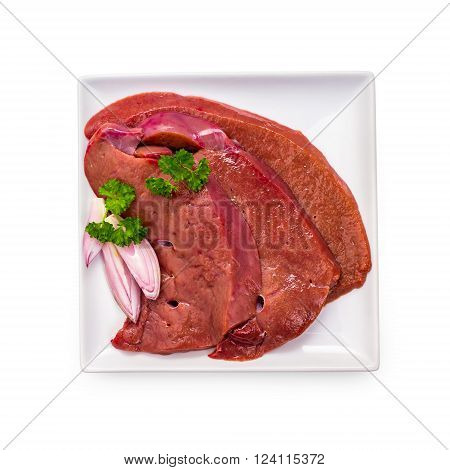 Three raw veal liver slices isolated on white plate, top view