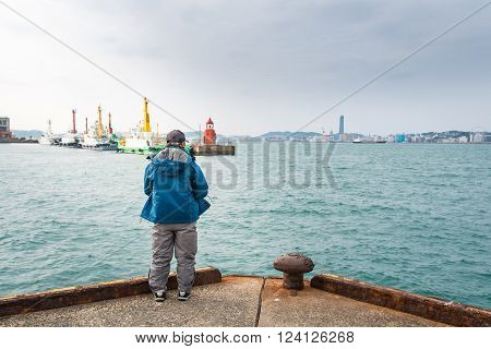 Japanese fisherman trying to fishing at mojiko port fukuoka japan.