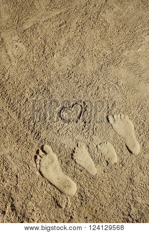 a Family feet on the sand on the beach