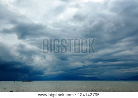 Dark storm clouds over Poso lake. Central Sulawesi. Indonesia
