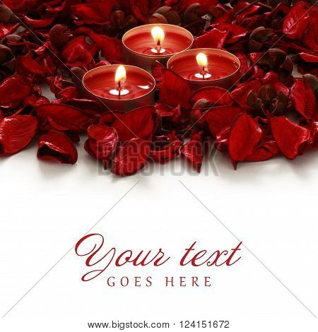 red roses and candles on whiter background with space for your text