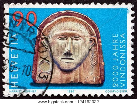 SWITZERLAND - CIRCA 1986: a stamp printed in the Switzerland shows Gallic Head Vindonissa Bimilennium circa 1986